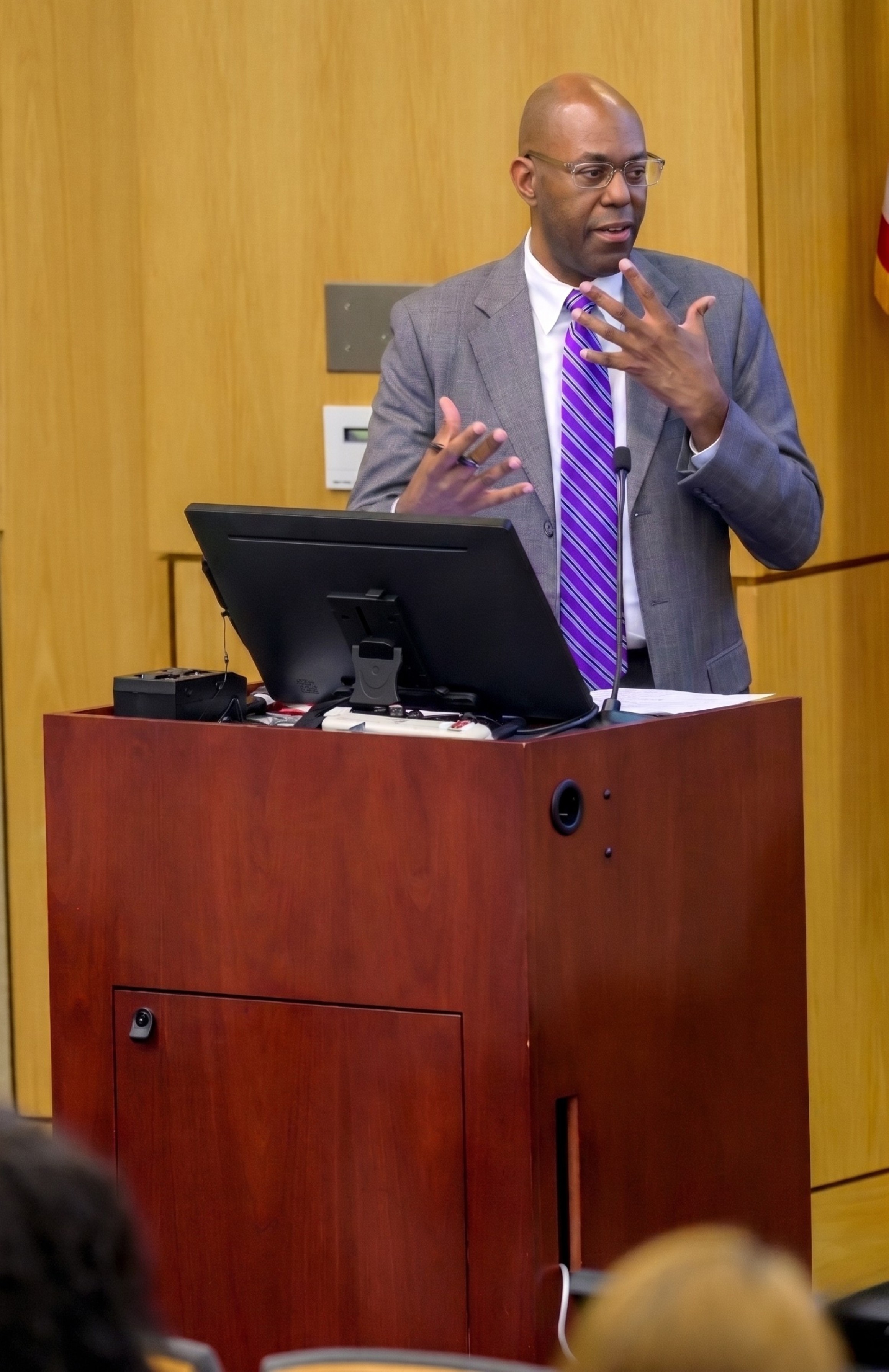 Louis Hill Jr. moderating Community Building panel at SMU